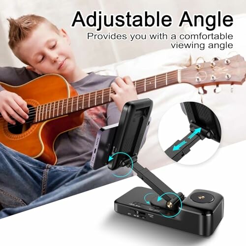 Boy playing guitar with an adjustable device holder.