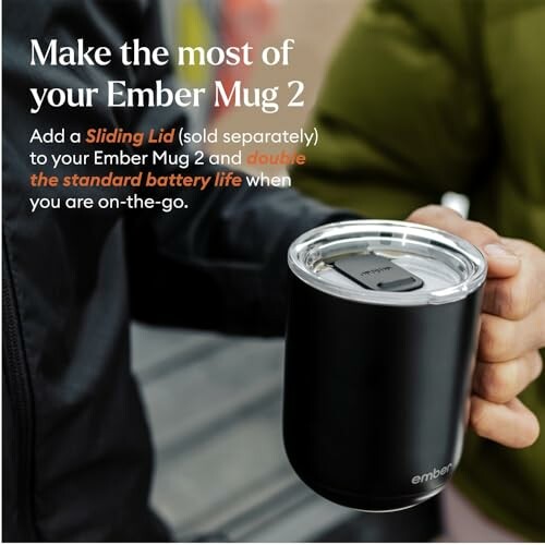 Person holding an Ember Mug 2 with sliding lid.