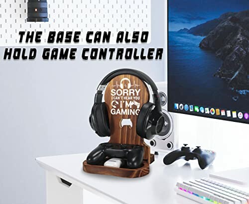 Desk with gaming headset stand holding headphones and controllers.