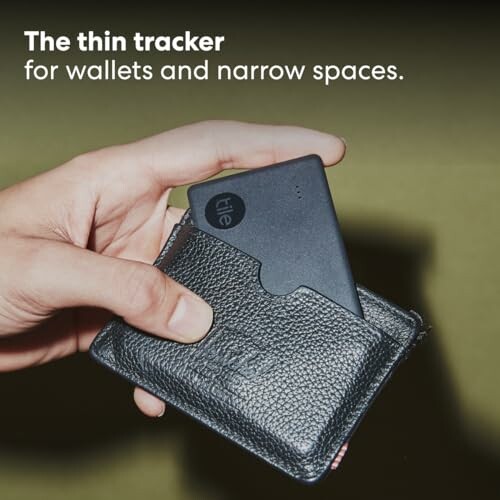 Thin tracker being inserted into a wallet.