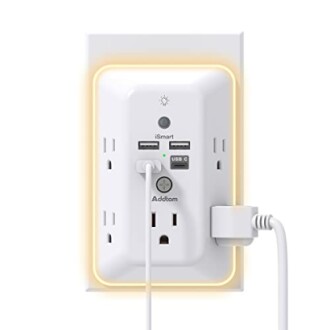 Wall outlet with USB ports and LED night light