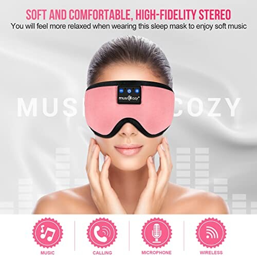 Pink sleep mask with built-in headphones and control buttons.